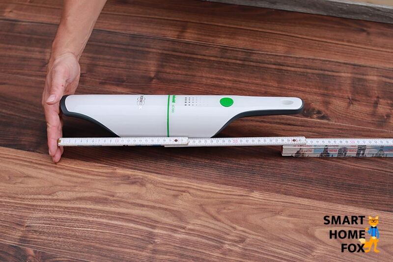 The Vorwerk Kobold VC100 measuring the size